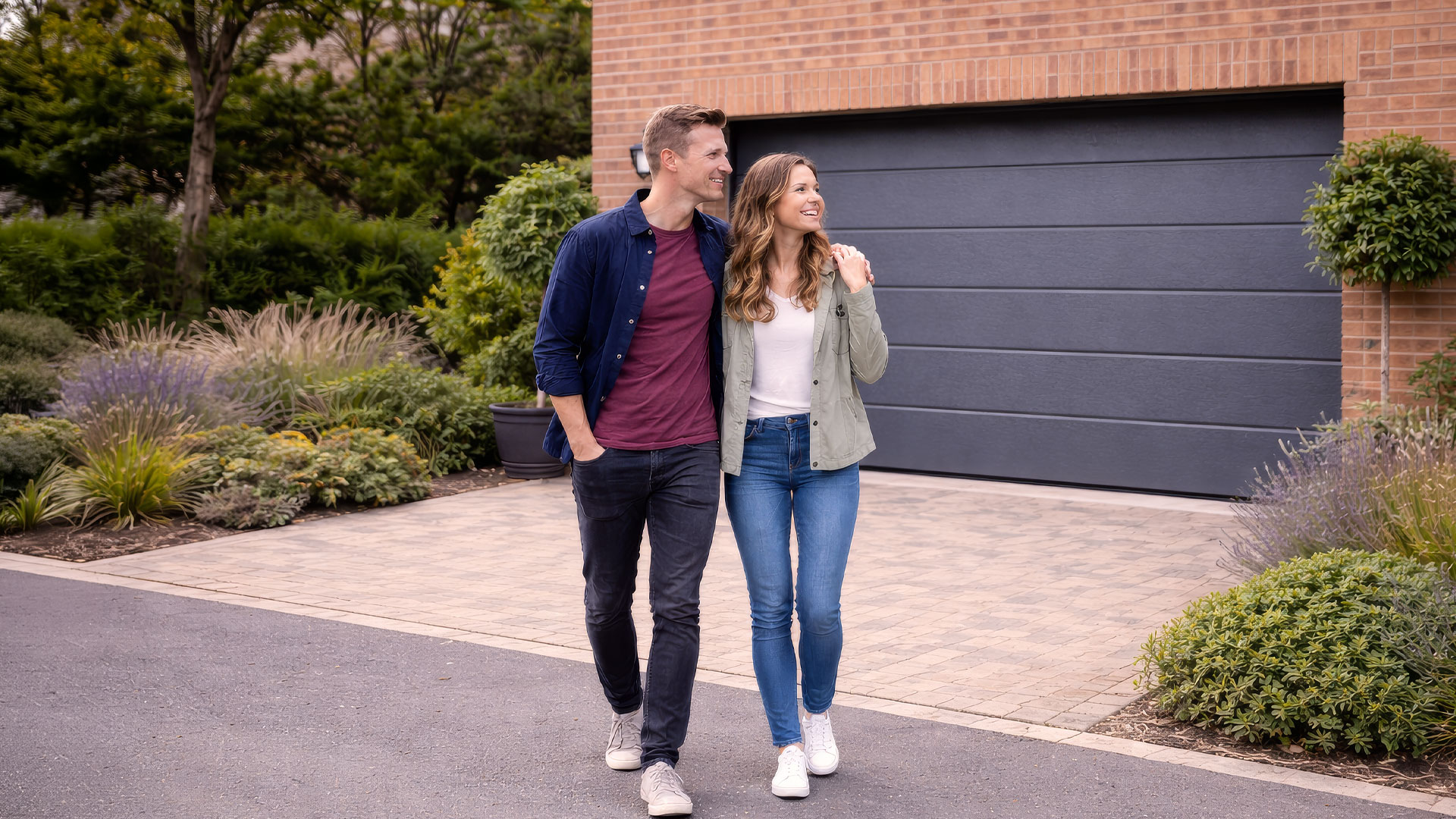 Couple in front of modern garage doors